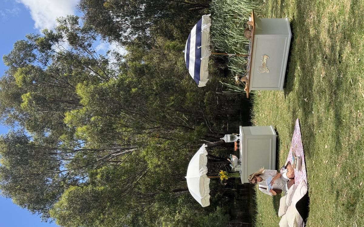Grazing cart positioned by riverbank at elegant outdoor event